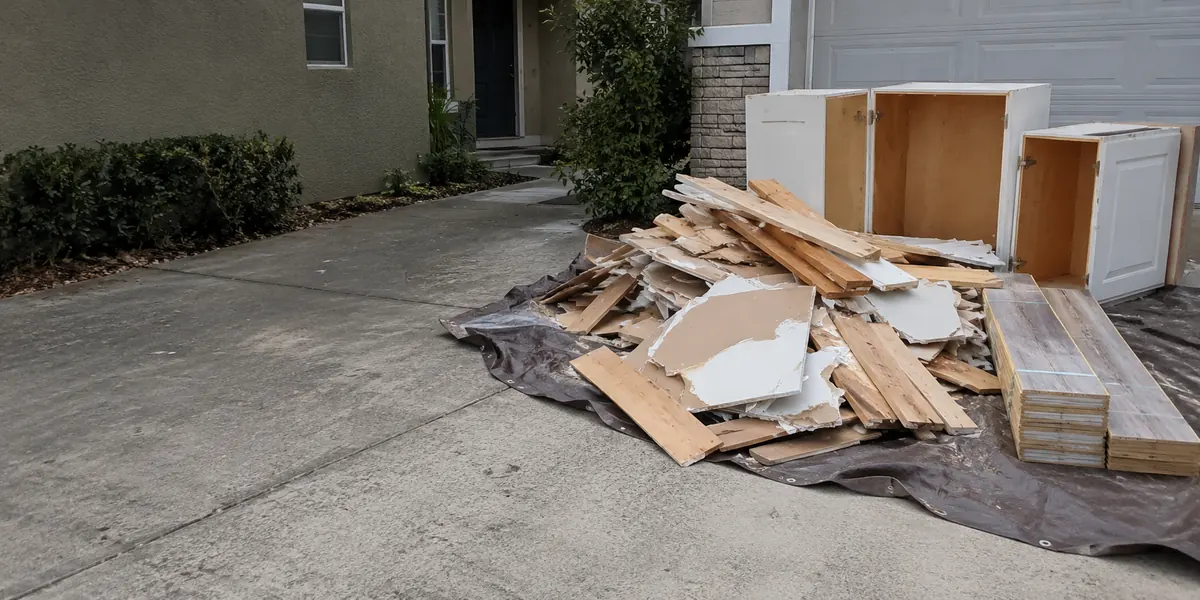 Construction debris beside a driveway