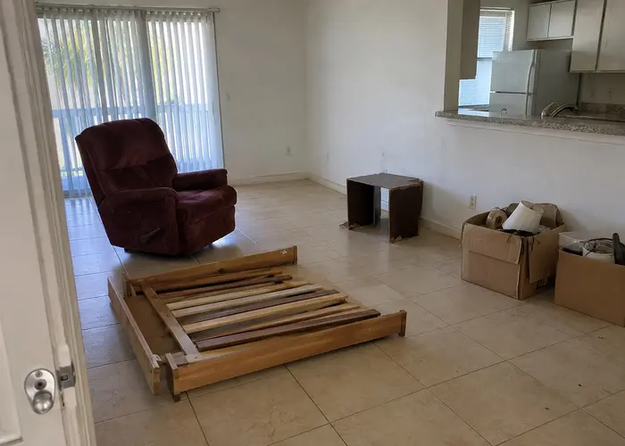 Furniture, bed frame pieces and boxes inside a home