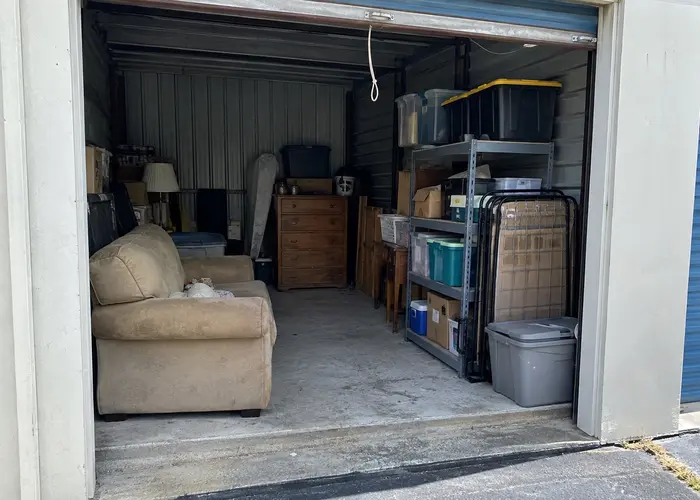 Furniture and bins inside a storage unit